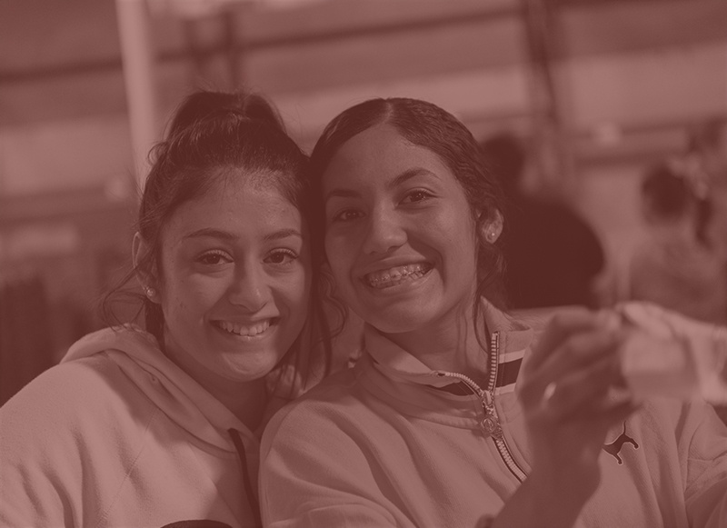 girls smiling together